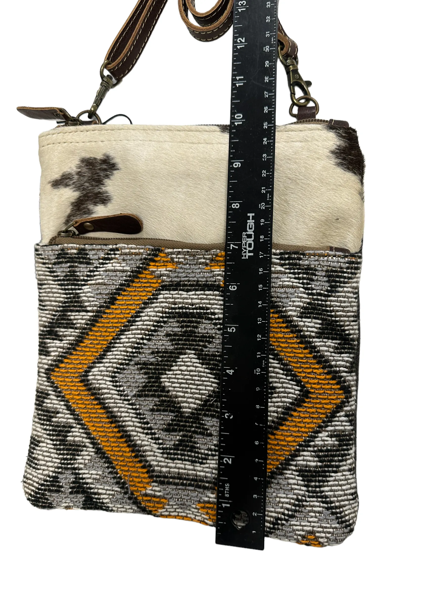 myra yellow and black cowhide canvas cross body  bag with tooled leather